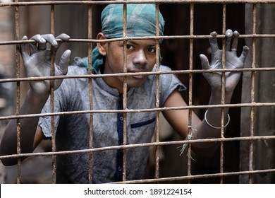 DHAKA, BANGLADESH - JANUARY 10, 2021: A Local Dark Factory Or Sweatshop In Bangladesh Where Underaged Young Kids Are Doing Child Labour Under Dangerous And Risky Circumstances Without Compliance