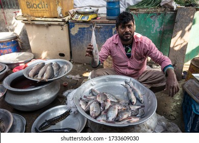 Dhaka / Bangladesh - January 14, 2019: Man Selling Small Fishes In Street Market In Old Dhaka