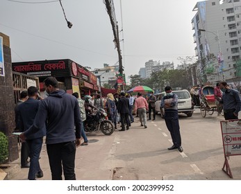 Dhaka, Bangladesh - January 15 2020: An Over Crowded Group Of People In Line Waiting To Get Their Food From A Bakery 