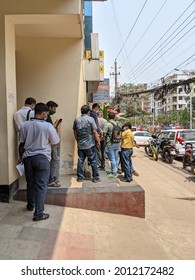 Dhaka, Bangladesh - January 15 2020: An Over Crowded Group Of People In Line Waiting On The Side Of Road For Shades 