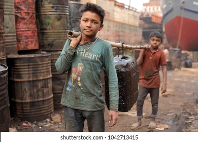 DHAKA - BANGLADESH - JANUARY 17, 2018: Unidentified child worker in a shipyard on January 17, 2018 in Dhaka, Bangladesh. Bangladesh has over 4.7 million child workers aged between 5 to 14.
