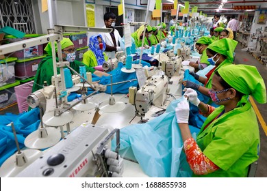 Dhaka, Bangladesh - March 31, 2020: Workers Producing Personal Protective Equipment (PPE) For Health Professionals At A Garment Factory Of Urmi Group In Dhaka On March 31, 2020.