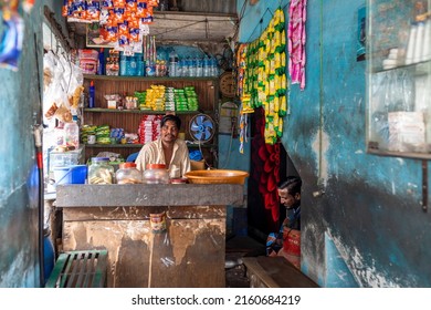 DHAKA, BANGLADESH - MAY 10, 2022: Portrait Of A Shop Keeper In A Small Shop Selling Grocery And Toiletry Items