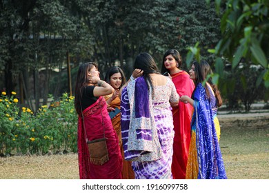 Dhaka, Ramna Park, Bangladesh: February 13,  2021:  A Group Of Girls Enjoying First Day Of Spring Wearing Saree , Selective Focus 