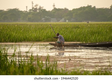 Dhaka,Bangladesh-03-05-2020 : fishing by boat in Bangladesh.Beautiful Asian landscape . 