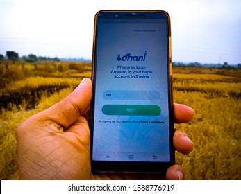 Dhani Instant Personal Loan Application Displayed On Digital Screen Holded Hand Mobile Phone At Agriculture Background In India Shot Captured On Dec 2019