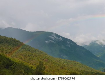 Dharamshala, Himachal Pradesh, India. August, 2019. A Post Rain View Of A Rainbow With Lush Green Mountains As Background.