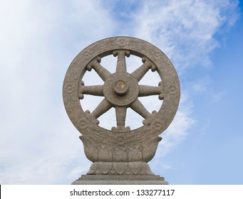 Dharmacakra Or The Wheel Of The Law On Cloundy Sky