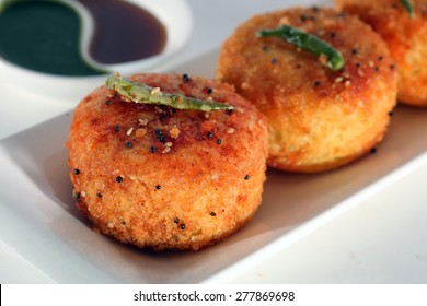 Dhokla Is A Vegetarian Food Item That Originates From Gujarat In India. It Is Made With A Fermented Batter Of Gram Flour.