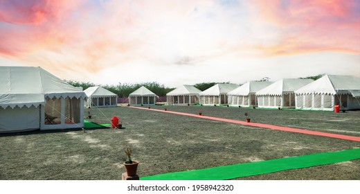 Dhordo, Gujarat - India - December 18 2019: Tents pitched in to accomodate visiting tourist for rann utsav. The tent city at Dhordho. Accomodation for tourists. Selective focus.