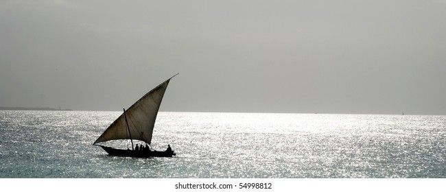 A Dhow Boat Sailing On The Coast Of Africa