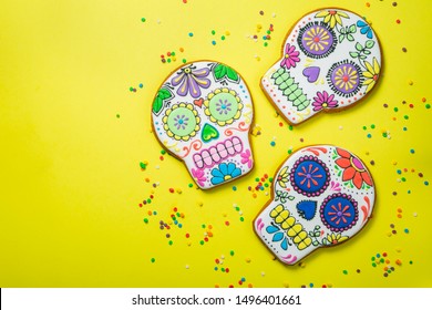 Dia de los muertos concept - skull shaped cookies with colorful decorations, top view