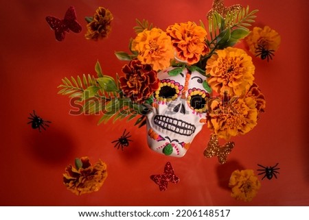 Dia De Los Muertos or Day of the Dead Celebration Background. 
Scull decorated with decor Marigold Flower. Mexican Traditional Festive background. Flat lay, top view.