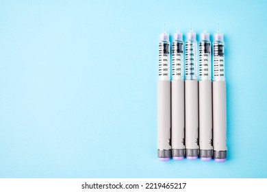 Diabetes Equipment Insulin Syringe, Injection Pen. Diabetes Disease Concept, Blue Background With Copy Space