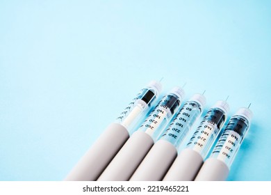 Diabetes Equipment Insulin Syringe, Injection Pen. Diabetes Disease Concept, Blue Background With Copy Space