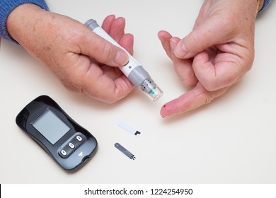 Diabetes Finger Prick Blood Test, Type 2 Diabetic Using Home Monitoring Glucometer