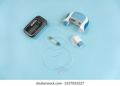 Diabetes management essentials featuring an insuling pump - Powered by Shutterstock