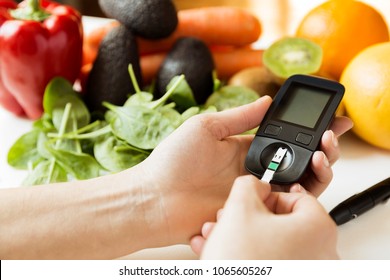 Diabetes Monitor, Diet And Healthy Food Eating Nutritional Concept With Clean Fruits And Vegetables With Diabetic Measuring Tool Kit