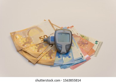 Diabetes Reader With Euros. Cost Of Diabetes In Europe. Health Care In Europe