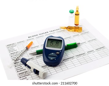 Diabetic Concept - Glucometer With Data 5.8, Diabetes Syringe, Pen And Medical Form On White Background 