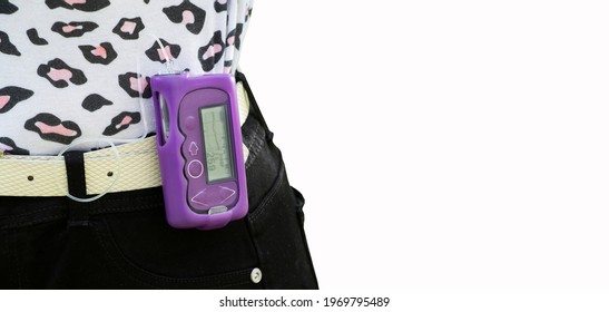 Diabetic Girl Applying An Insulin Pump - Childhood Diabetes Concept