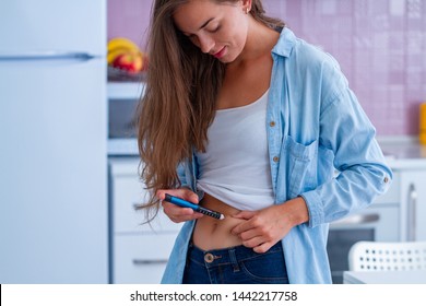 A Diabetic Patient Using Insulin Pen For Making An Insulin Injection At Home. Young Woman Control Diabetes. Diabetic Lifestyle 