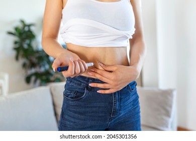 A Diabetic Patient Using Insulin Pen For Making An Insulin Injection At Home. Young Woman Control Diabetes. Diabetic Lifestyle