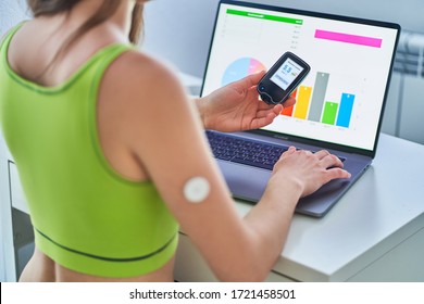 Diabetic Patient Using Remote Sensor And Computer For Online Monitoring And Examining Glucose Blood Levels Graphs. Diabetes Control 