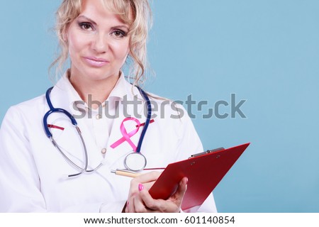 Diagnosis of breast cancer. Blonde middle aged female holding red folder with files of desease diagnose. Specialist inform patient about results. 