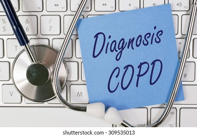 Diagnosis COPD - Blue Note Paper With Text On Computer Keyboard With Stethoscope