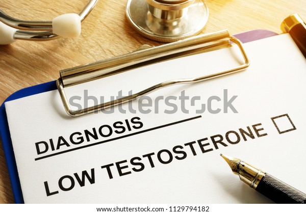 Diagnosis Low\
testosterone and pen on a\
desk.