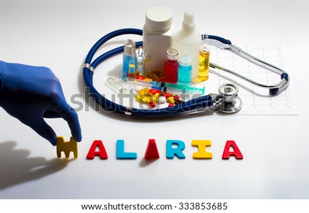 Diagnosis - Malaria. Medical concept with pills, injection, stethoscope, cardiogram and a syringe
