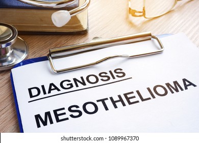 Diagnosis Mesothelioma And Stethoscope On A Desk.