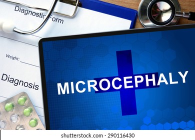 Diagnosis  Microcephaly On A Tablet And Stethoscope.