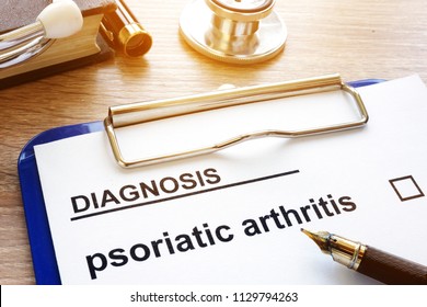 Diagnosis Psoriatic Arthritis And Clipboard On A Desk.