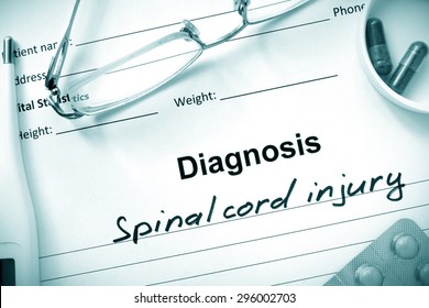  Diagnosis  Spinal Cord Injury, Pills And Stethoscope.