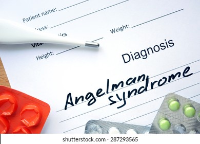 Diagnostic Form With Diagnosis Angelman Syndrome And Pills.