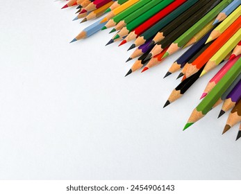 Diagonal arrangement of sharp multi colored pencils on white background with empty space for text. Artistic concept for stationery, education, design advertising banner for school products. - Powered by Shutterstock