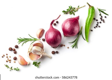 Diagonal composition of red onions, garlic and various spices isolated on white background, top view - Shutterstock ID 586243778
