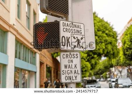 Diagonal crossing sign in the city