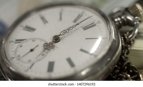Dial on ancient pocket watch against cash background, business strategy, life