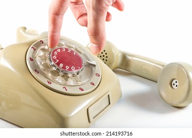 dialing up on a vintage telephone  - Shutterstock ID 214193716