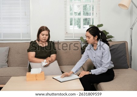 Dialogue and Reflection. A therapist and client engage in meaningful conversation during a therapy session.