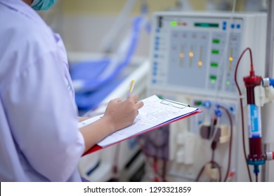 Dialysis nurse are checking dialysis machine before hemodialysis replacement kidney dysfunction or renal failure in intensive care unit.