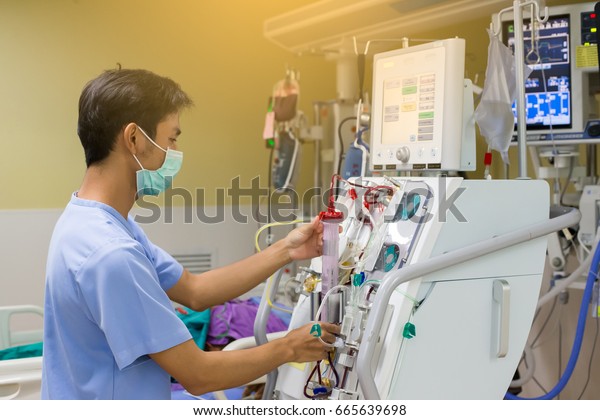 Dialysis Nurse Checking Dialysis Machine Before Stock Photo (Edit Now