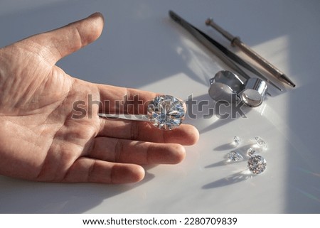 Diamond appraisal process at diamond dealer's workplace. Diamond business.