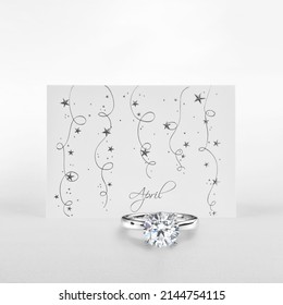 Diamond April's Birthstone. Solitaire Diamond Ring on Card Featuring Word April. 