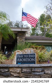 Diamond Bar, California - April 11, 2022 : Pray to End Abortion Sign with National Flag in front of a Private Residence