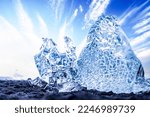 Diamond Beach in Iceland with blue icebergs melting on the black sand and ice glistening. Arctic nature scenery, Icelandic South coast, Jokulsarlon