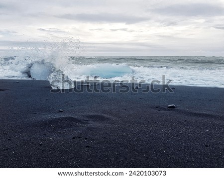 Diamond beach. Jökulsárlón, Iceland. Icebergs and black sand